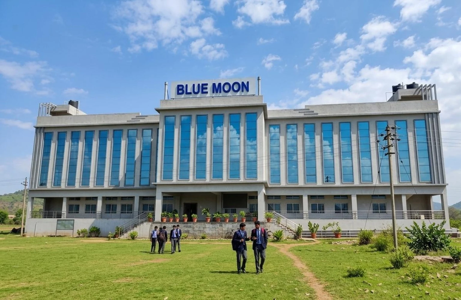 Blue Moon hostel building exterior with students